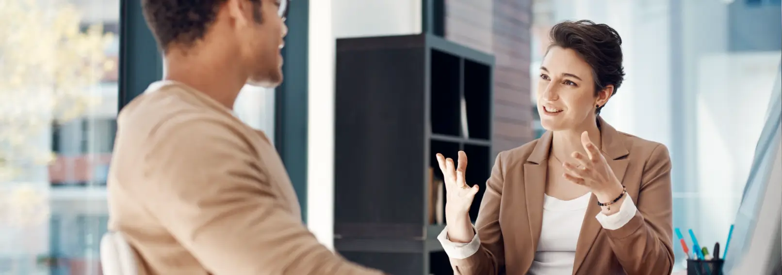 Male and female co-workers represent a business casual look.