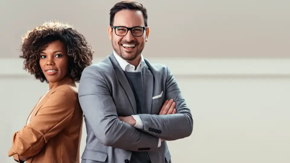 A man and woman dressed for a business-casual dress code.
