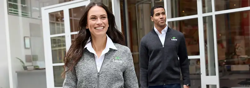 Man and woman dressed in Lands' End Outfitters business uniform zippered jackets